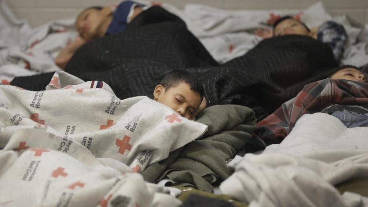 Child detainees sleep in a holding cell at a U.S. Customs and Border Protection processing facility in Brownsville, Texas, June 18, 2014.