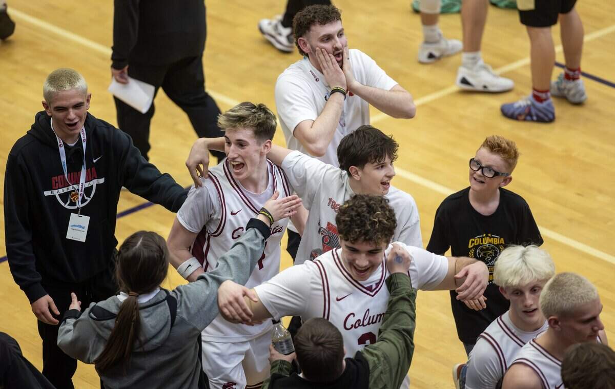 Columbia players react to their overtime win in their 5A boys basketball state tournament game against Vallivue held at Rocky Mountain High School, Thursday, March 5, 2026. Columbia won 69-68.