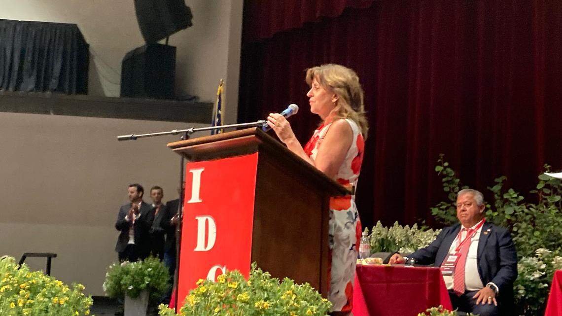 Dorothy Moon, left, speaks to delegates at the Idaho GOP State Convention after Republicans elected her state chair on Saturday, July 16, 2022. Moon defeated Tom Luna, right, who sought reelection to state party chair.