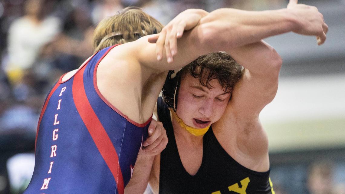Bishop Kelly’s Christopher Martino, right, topped New Plymouth’s Kyle Rice to capture his first Rollie Lane Invite championship. Martino won with a 9-4 decision.