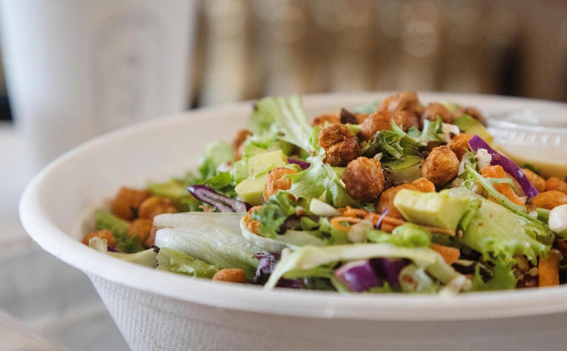 A $12 seasonal salad comes with snap peas, cucumbers, sprouts, radishes, baby spinach, goat cheese and green goddess dressing.