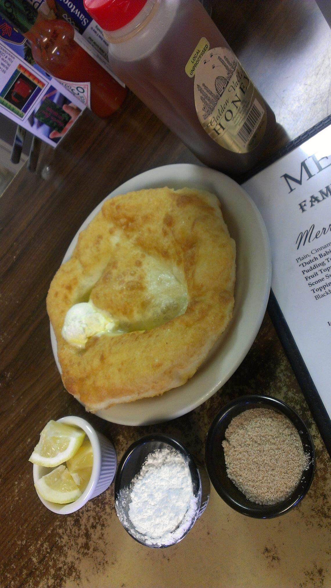 Breakfasts at Merritt’s Country Cafe come with a plate-sized scone, served with honey butter.