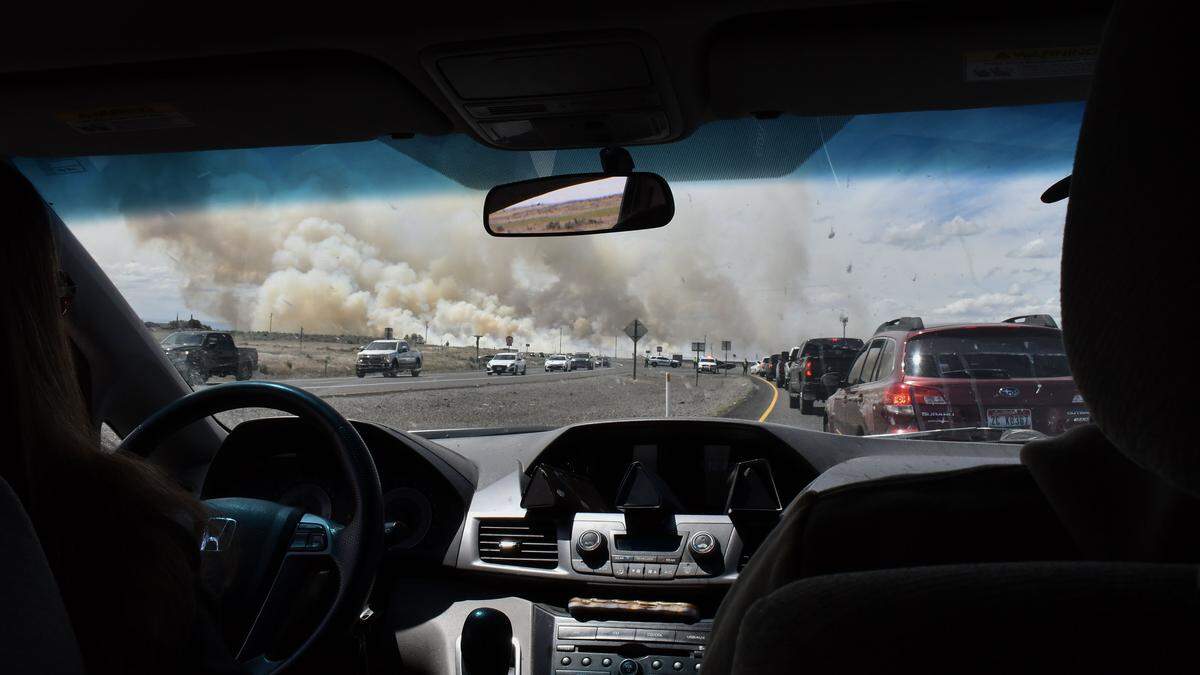 A wildfire sparked by a midair collision of two jet fighters at Gunfighter Skies air show at Mountain Home Air Force Base causes traffic delays.