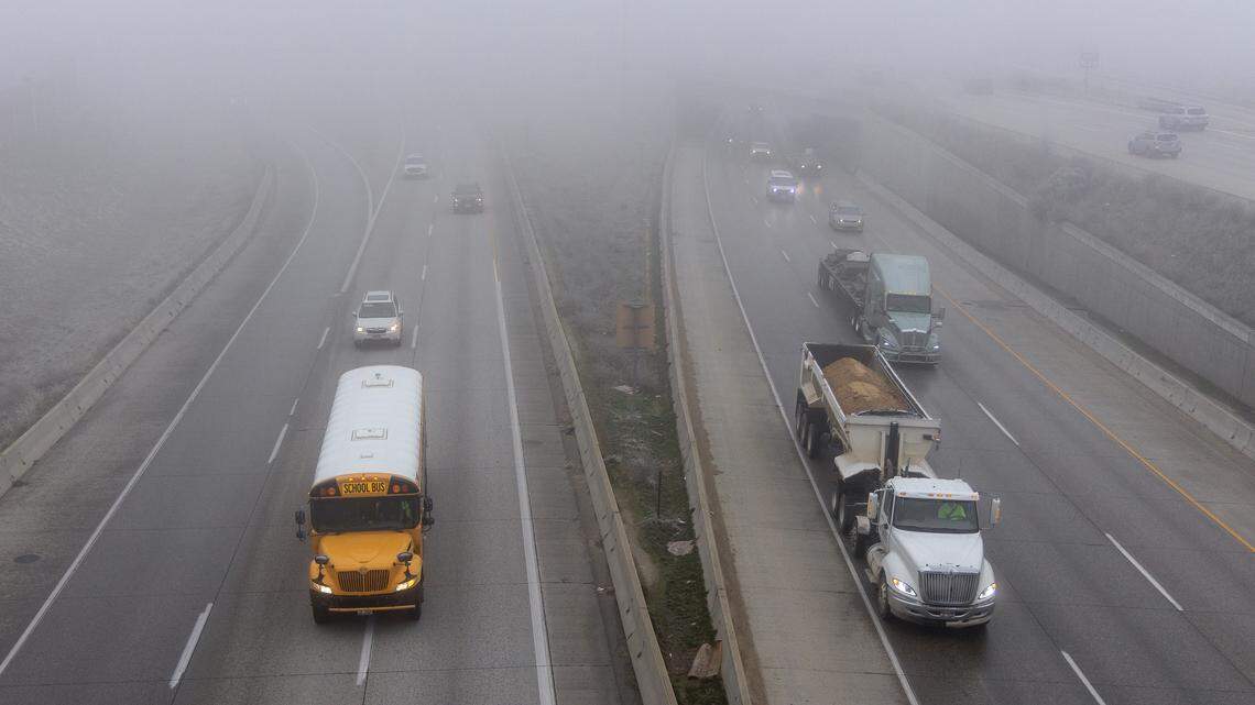 Fog from an inversion makes traffic hard to see near the Flying Wye on I-84 in Boise.