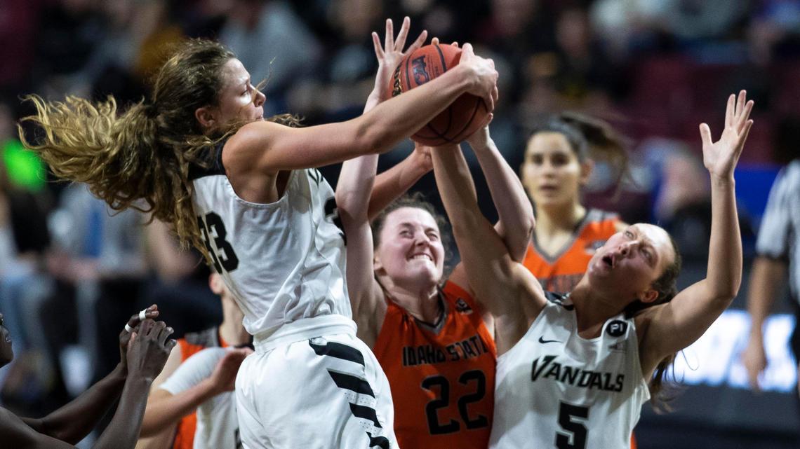 Idaho State forward Delaney Moore gets sandwiched between Idaho’s Lizzy Klinker and Beyonce Bea (5) on a rebound in the semifinals of the Big Sky women’s basketball tournament Wednesday at CenturyLink Arena in Boise. Idaho advanced to the championship game, defeating ISU 66-51.