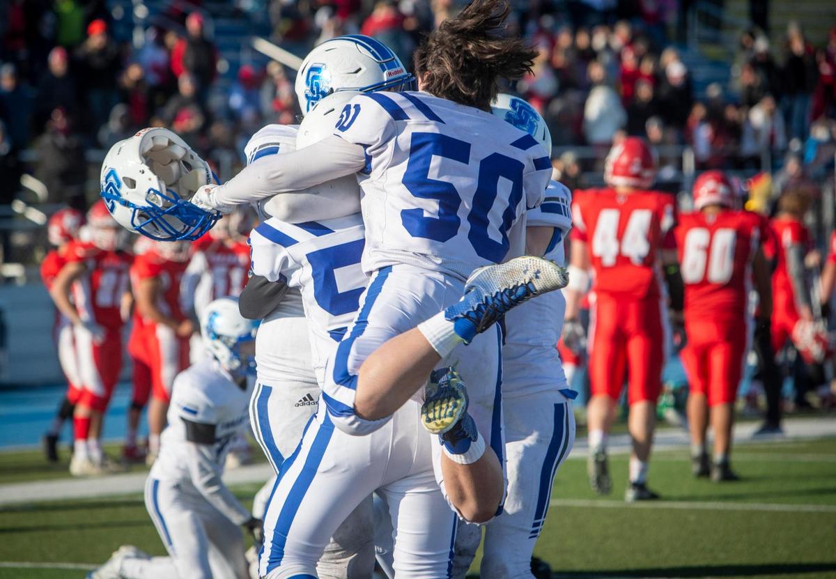 Mason Weber (50) ecstatically celebrates Sugar-Salem’s 34-28 win in overtime for the 3A football state championship Saturday at Middleton High.