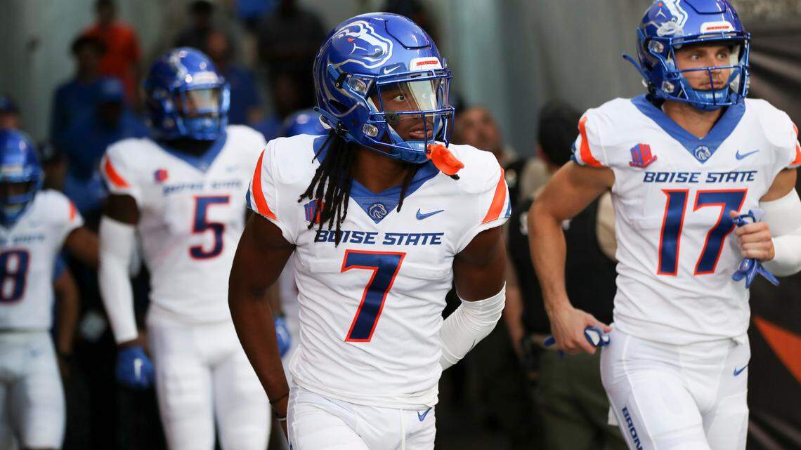 Boise State wide receiver Latrell Caples (7) leads the Broncos onto the field before the season opener at Oregon State. Caples caught the first two touchdown passes of his career last week at New Mexico.