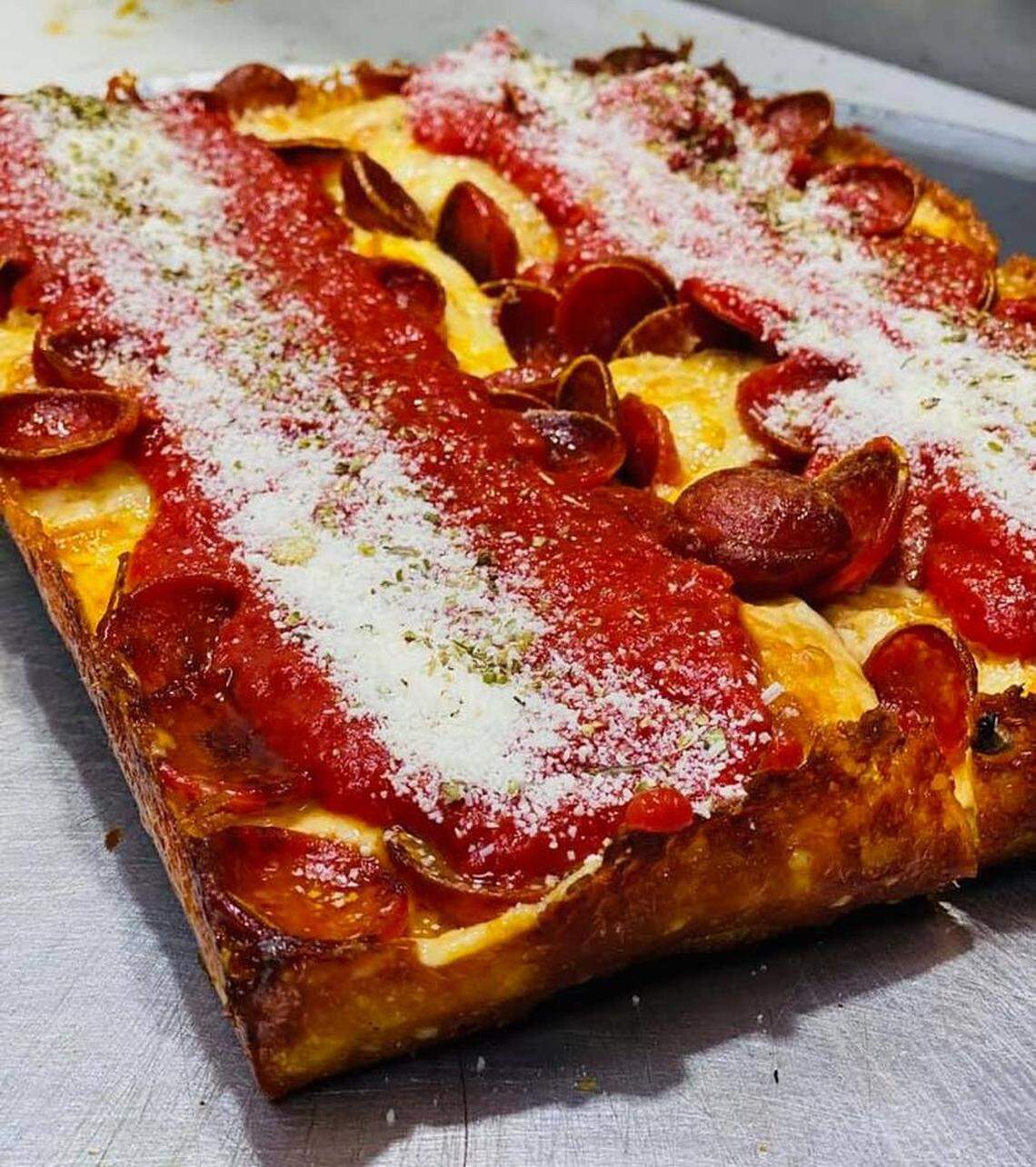 The Rosa Detroit pizza is cooked in a steel pan.