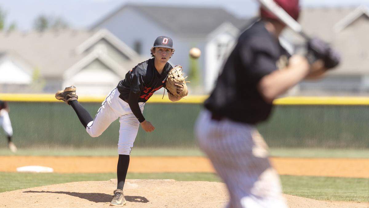 Owyhee's Knox Thomas pitches with Rigby's Joseph Madsen at bat during the 6A baseball regional tournament championship game, Saturday, May 9, 2026, held at Owyhee. Owyhee won 6-1.