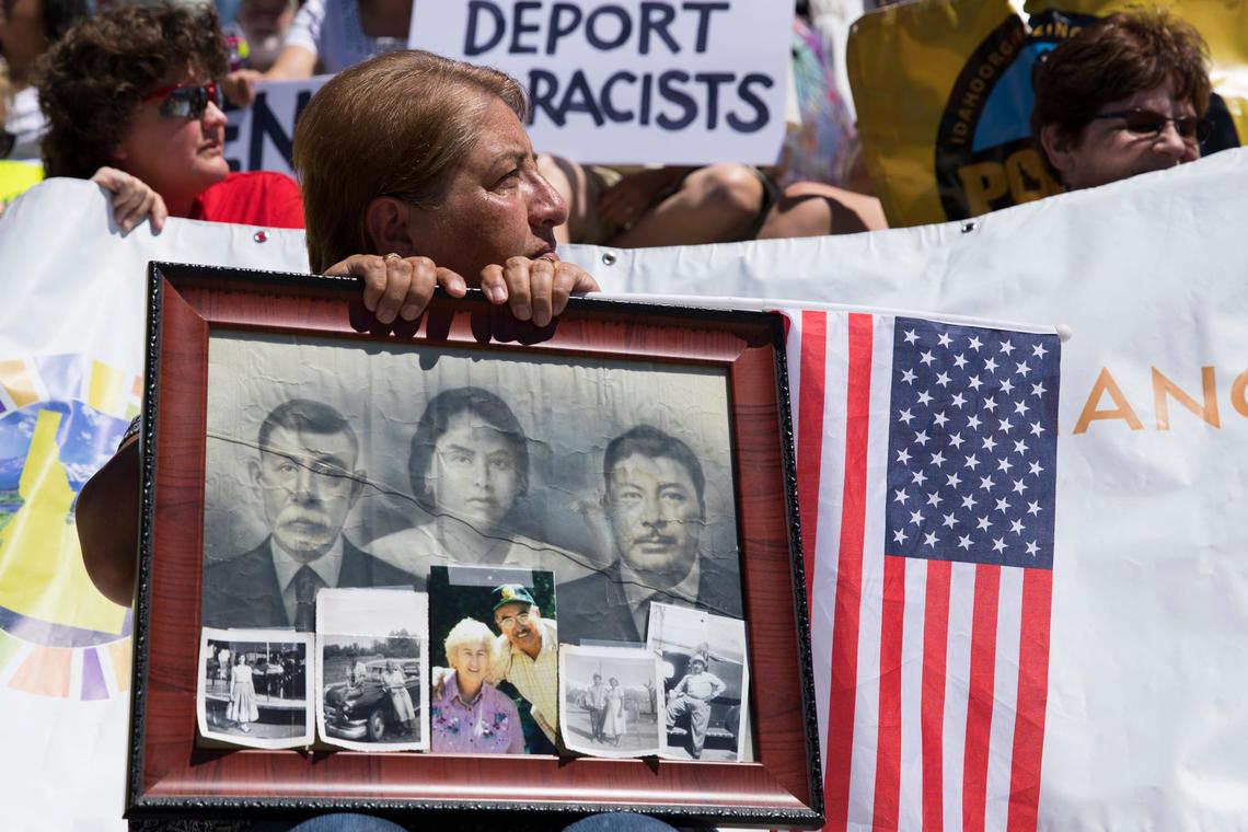 Patricia Uranga-Melchor listens to a speech at the “Families Belong Together” rally in front of the Idaho Capitol on Saturday. Uranga-Melchor’s grandfather was an immigrant from Mexico.