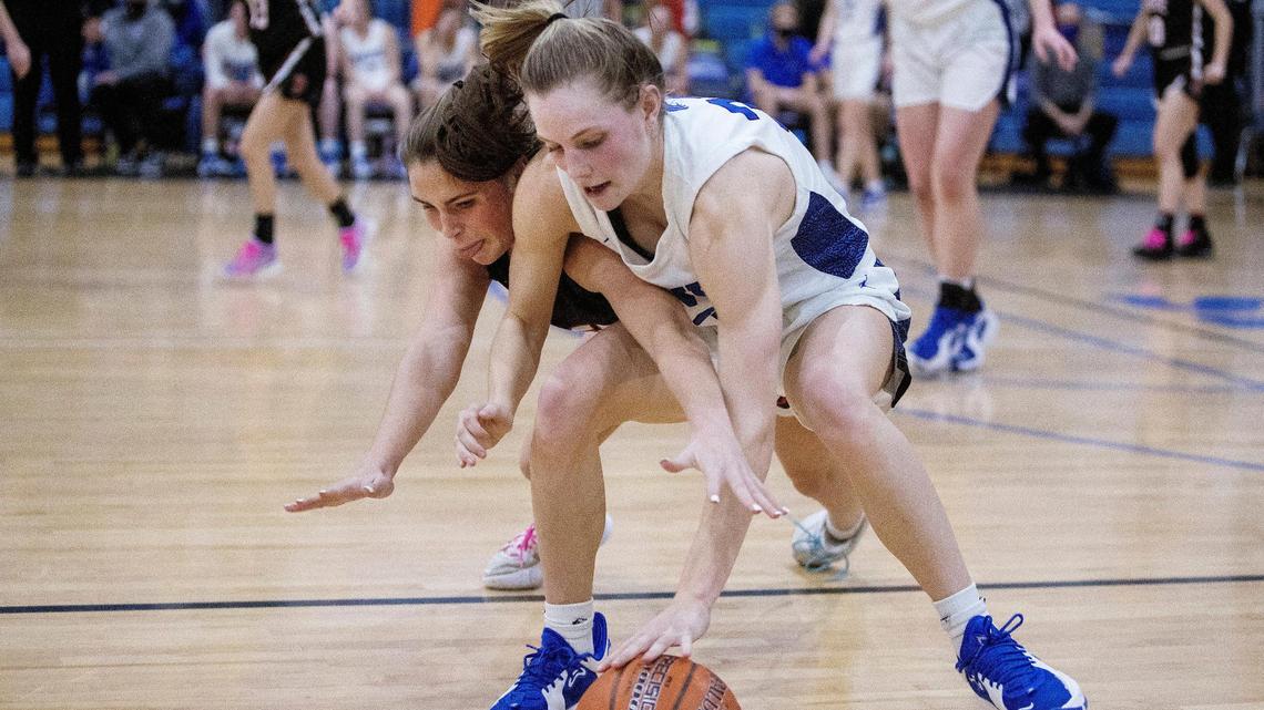 Boise freshman Maizy Kluksdal, left, and Timberline junior Lauren McCall scramble for a loose ball Jan. 25. Timberline and Boise enter as two of the top teams to watch at the 5A state tournament, which tips off Thursday at the Ford Idaho Center in Nampa.