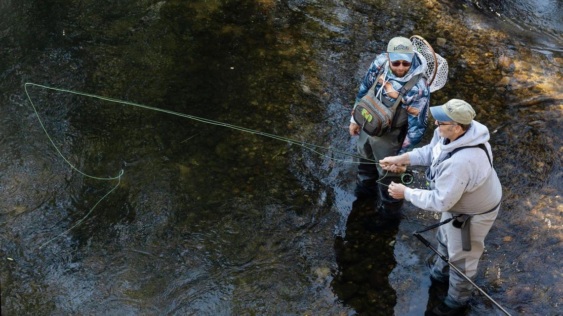 Volunteer José Karry, left, teaches Russell Massey, of Nampa, how to fly fish on the Boise River on Oct. 9 during a day retreat for Idaho2Fly. Idaho2Fly is a nonprofit that helps men with cancer connect with one another through fly fishing together.