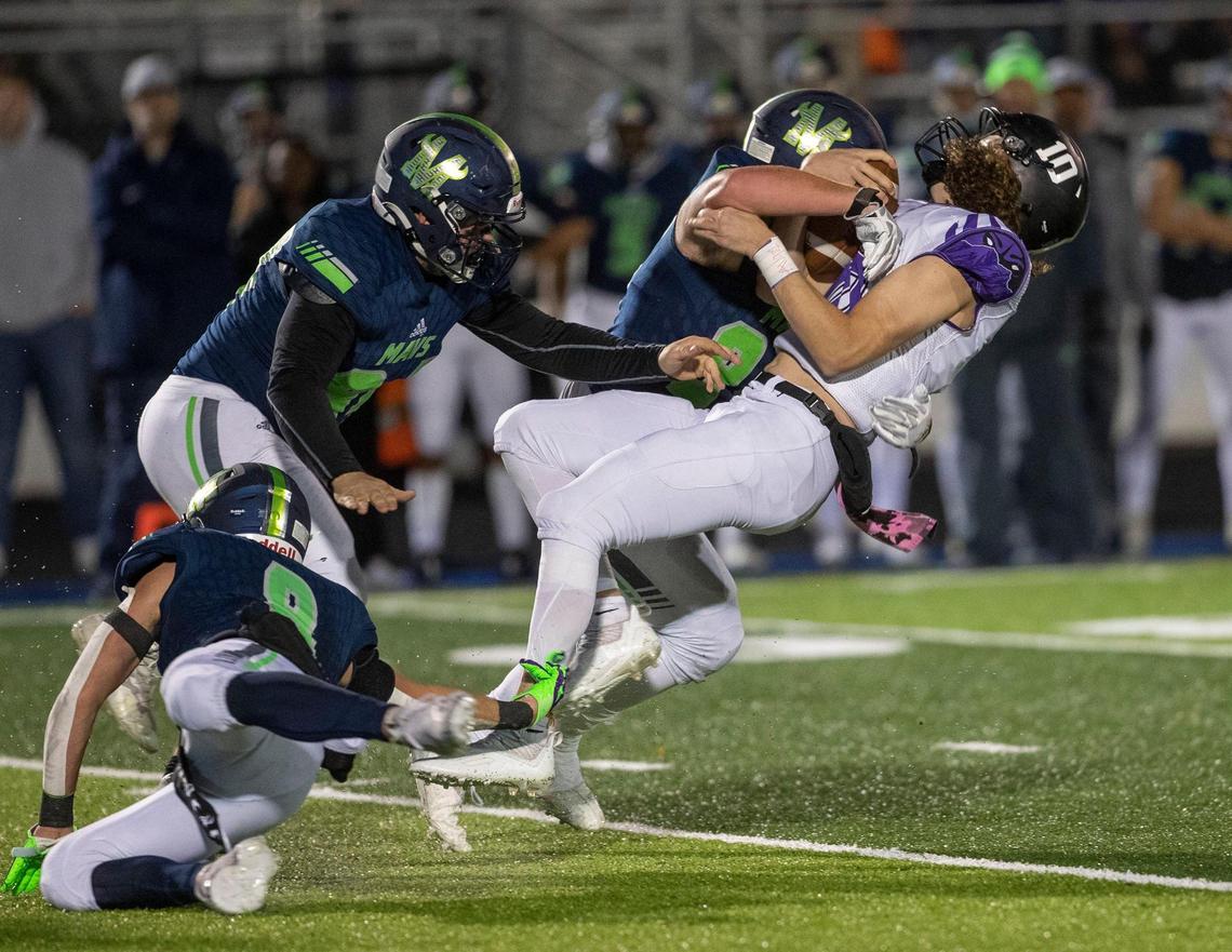 Mountain View defensive lineman Grant Hilderbrand levels Rocky Mountain quarterback Tegan Sweaney in the 5A SIC championship game Friday.