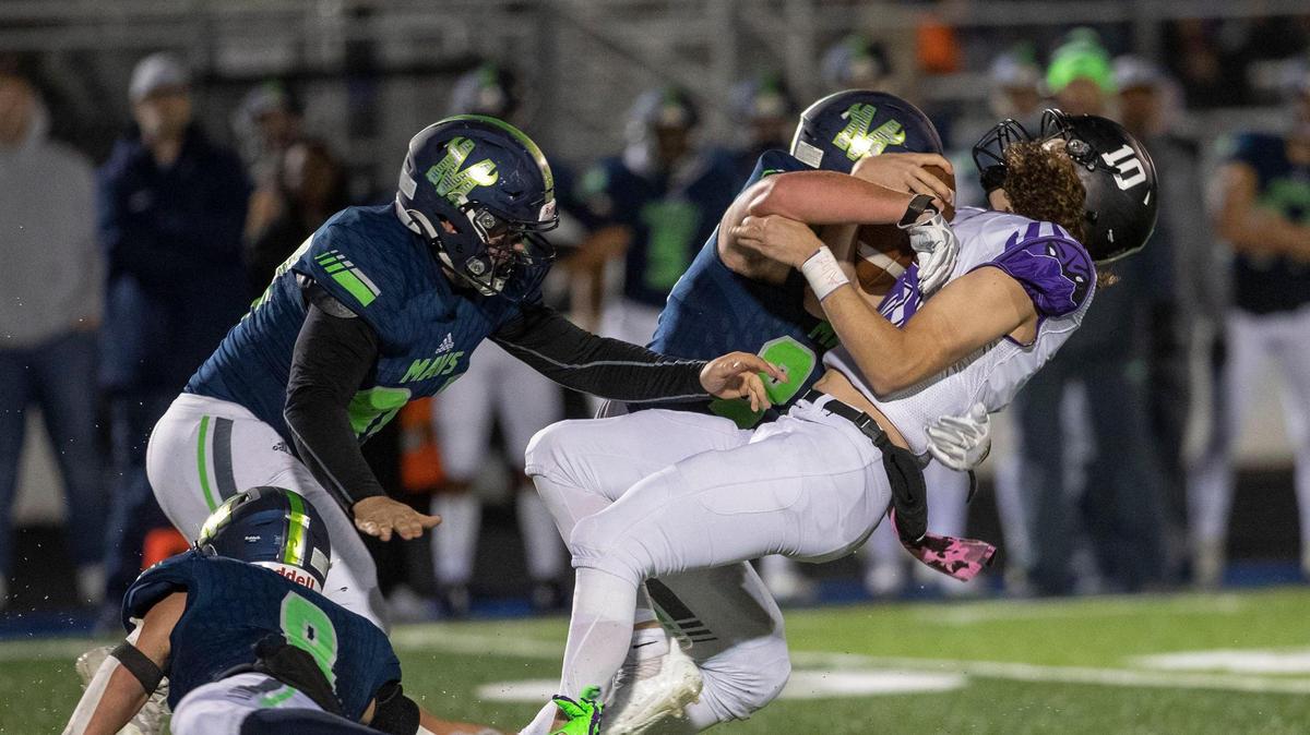 Mountain View defensive lineman Grant Hilderbrand levels Rocky Mountain quarterback Tegan Sweany during the 5A SIC championship game two weeks ago. The Mavericks (9-0) host Meridian (7-3) in the 5A quarterfinals Friday.