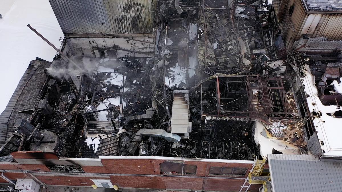 The aftermath of a fire on Tuesday at the Darigold dairy plant in Caldwell is seen Wednesday. The three-alarm fire caused part of the building’s roof to collapse.