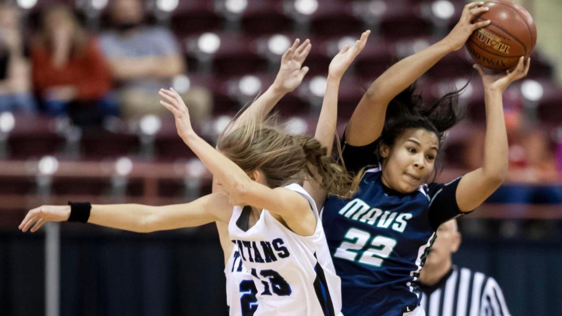 Mountain View’s Naya Ojukwu rips down a rebound in the 5A state championship game last February. She has signed to play basketball and volleyball at Utah.