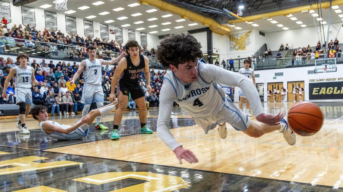 Ambrose guard Lincoln Mathis dives to stop a ball from going out of bounds during last year’s state semifinals.