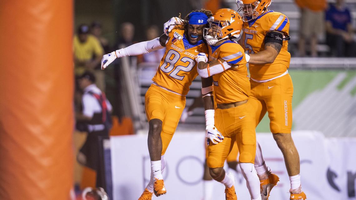 Boise State wide receiver Stefan Cobbs, left, celebrates his 44-yard touchdown reception with teammates Khalil Shakir, center, and Garrett Collingham during the Broncos’ 45-10 home win over Portland State in 2019.