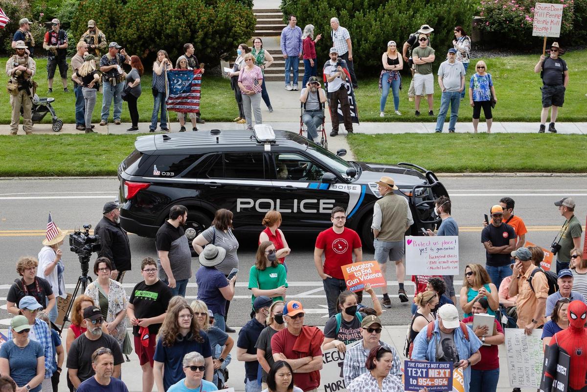 Supporters of the right to bear arms stand across the street, some with guns, while a March For Our Lives focused on anti-gun violence takes place in front of the Idaho Capitol in Boise on Saturday.