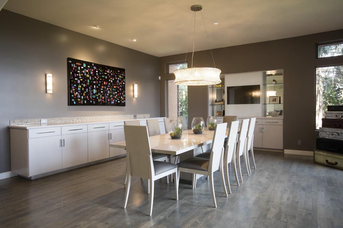 The dining room has been drastically remodeled by adding the ceiling. The former room was two-stories and featured a stained glass window. The Wendlandts created a media room on the new second floor room.