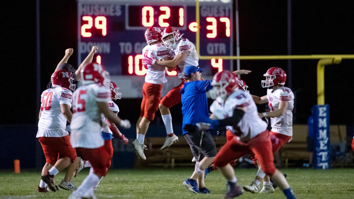 Nampa celebrates a 37-29 victory over Emmett as time runs off the clock in the first round of the 4A football state playoffs Friday at Emmett High.