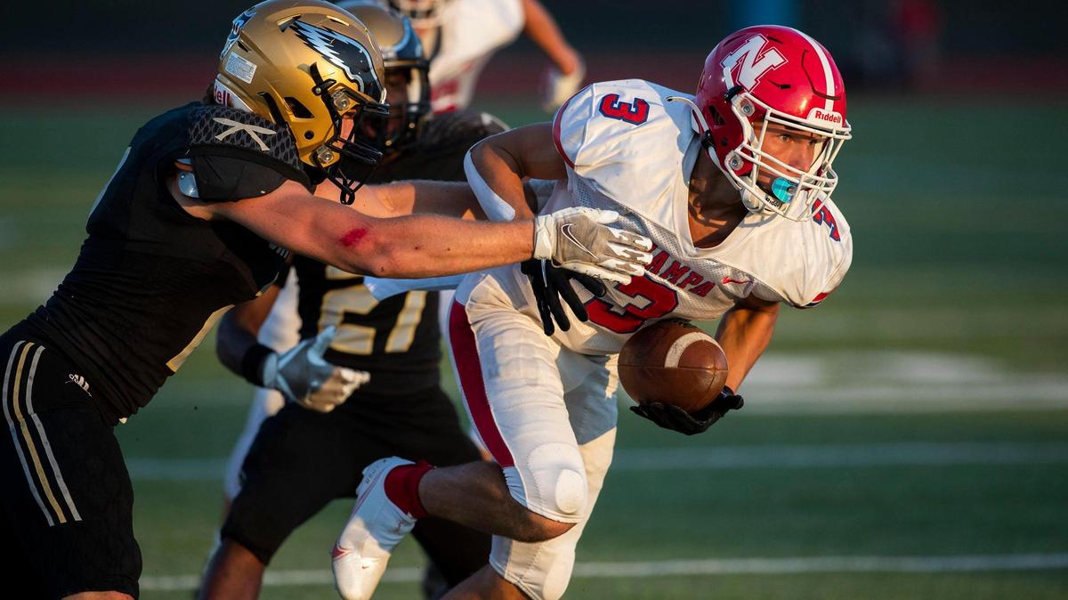 Nampa wide receiver Trais Higgins fights for extra yards Aug. 26 against Capital. The two met in a nonconference game this year. But with Nampa moving up to 5A next year, it will be a conference game.