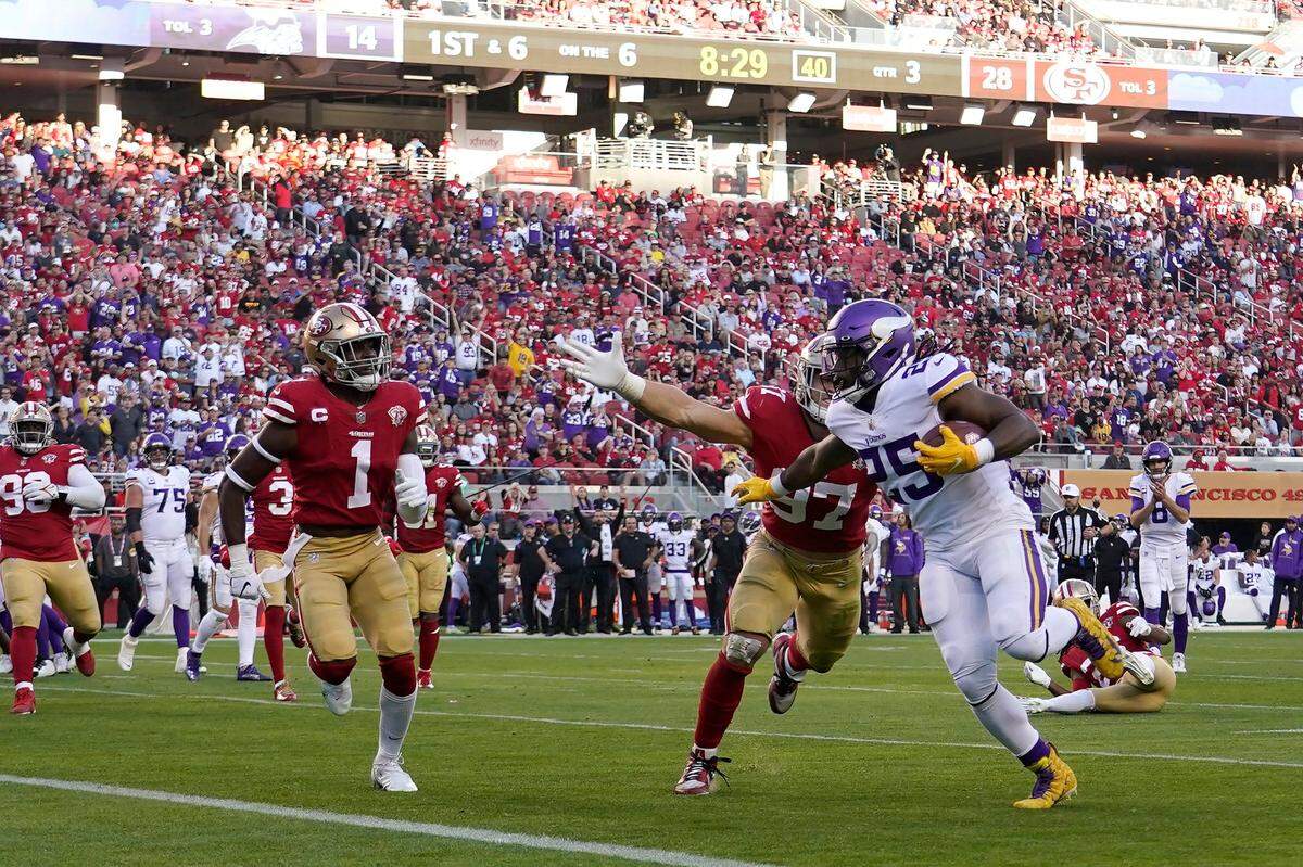 Minnesota Vikings running back Alexander Mattison runs for a touchdown past San Francisco 49ers defensive end Nick Bosa on Sunday in Santa Clara, Calif.