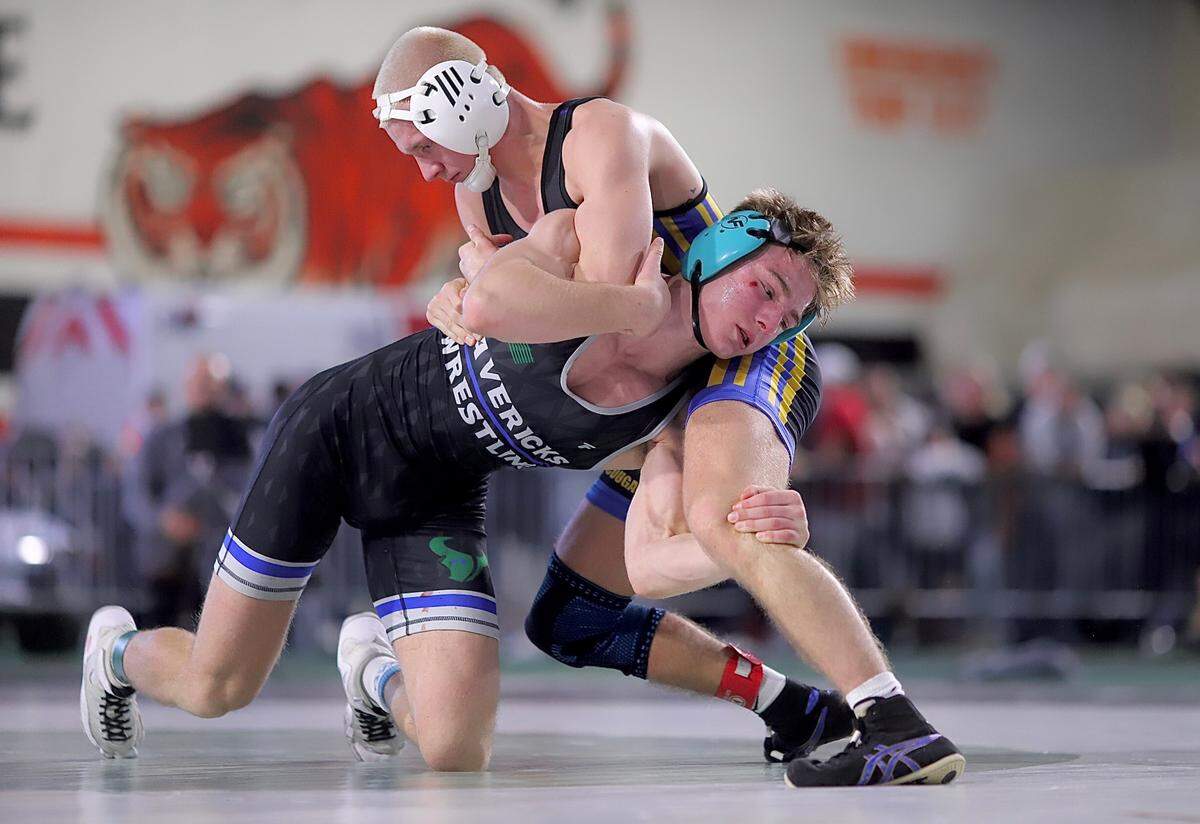 Mountain View’s Ian Avalos, bottom, enters as the top seed in the 6A 144-pound bracket at this week’s state tournament. 