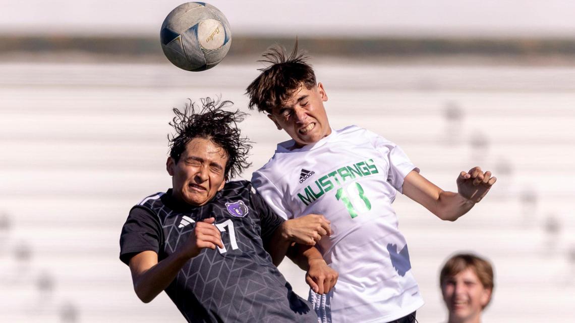 Eagle midfielder Hector Rivera, right, leaps for a header against Rocky Mountain’s Kevin Juarez in the semifinals of the 5A boys soccer tournament Friday.