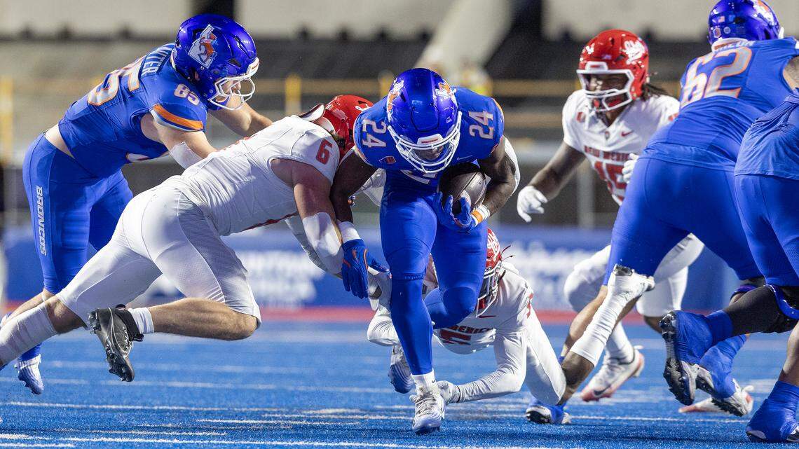 Boise State running back Dylan Riley looks for yardage against New Mexico on Saturday night. Riley had a 100-yard game to lead the rushing attack.