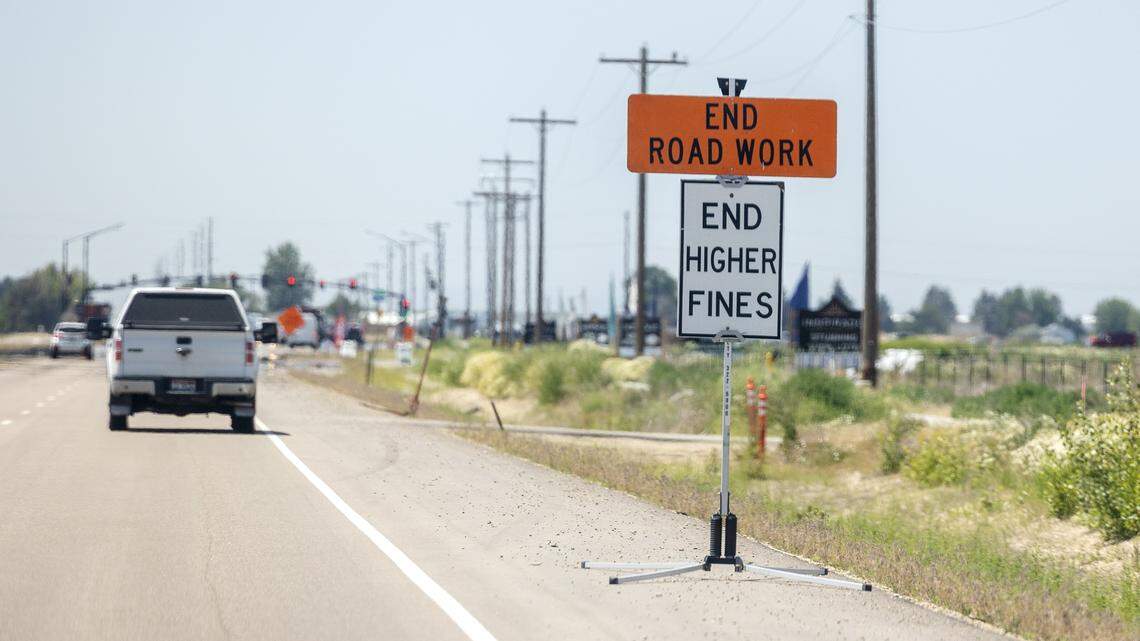 Signs indicate road work areas with higher fines on US-20/26 in Ada County June 18, 2025.