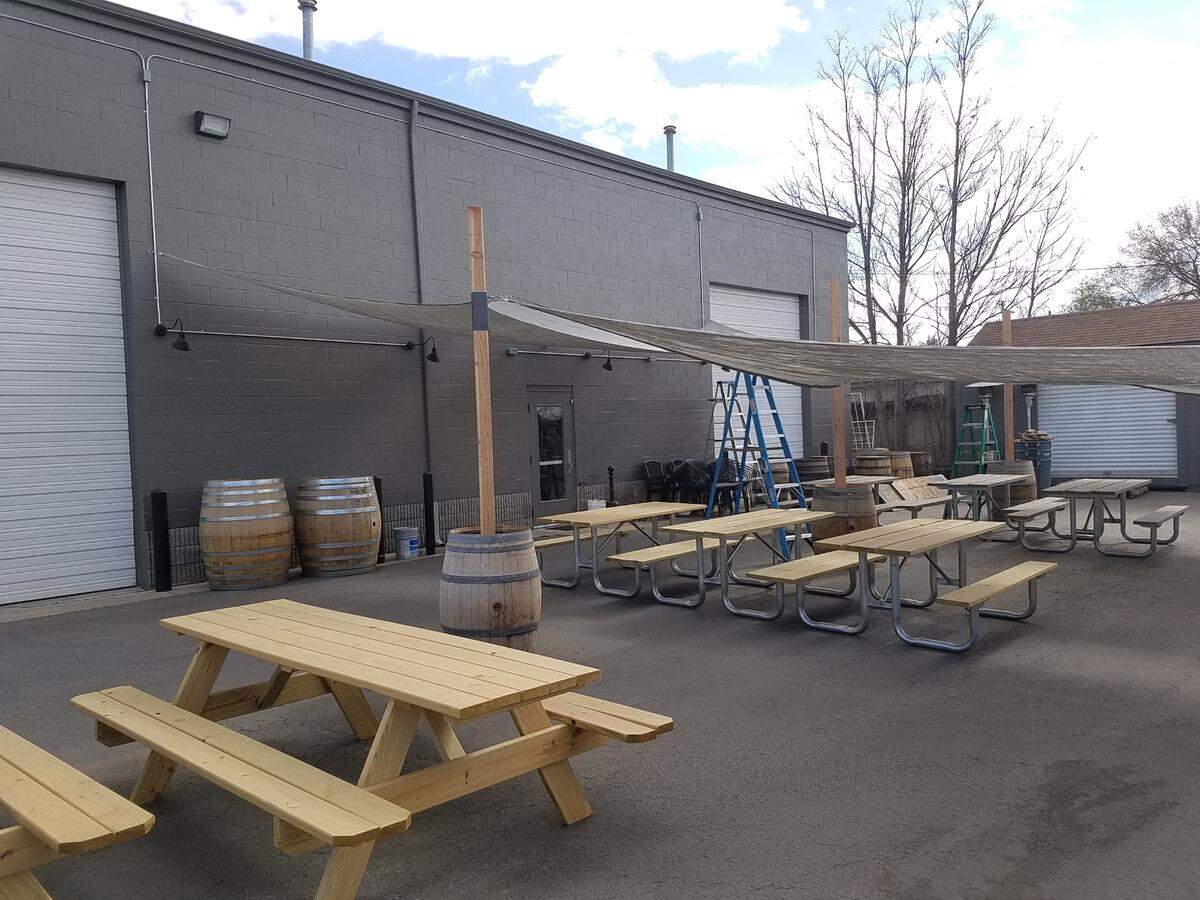 Picnic tables are set up behind the new Barbarian Brewing in Garden City.