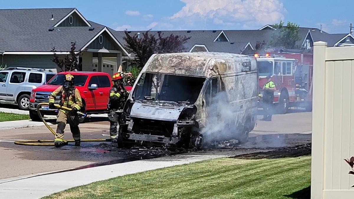 Firefighters in Kuna tend to an Amazon delivery van after it caught fire Saturday.
