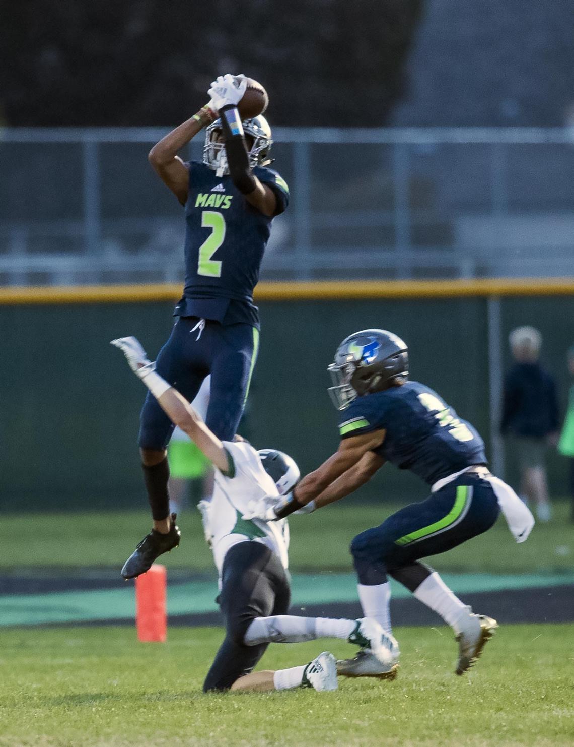 Mountain View’s K.J. Lynch leaps for an interception last fall against Eagle.