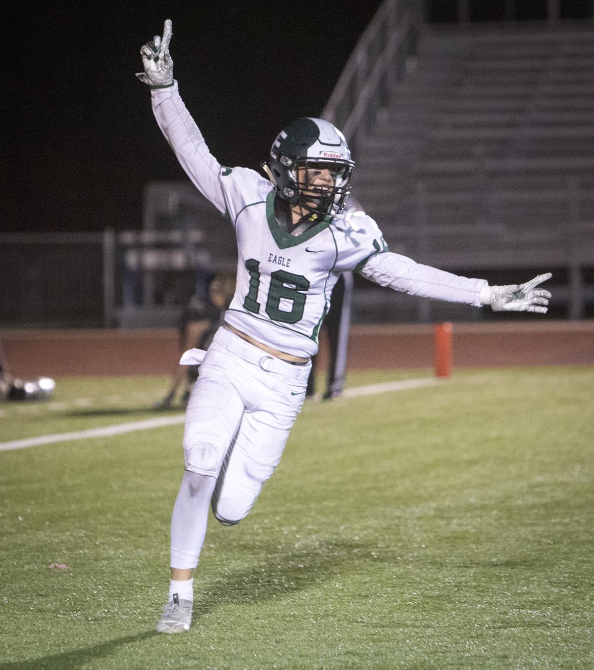 Eagle’s Gannon Matthews celebrates after Capital’s fourth-down touchdown pass attempt was no good with 1:49 left in the game. Eagle beats Capital 36-32 at Dona Larsen Park on Thursday, Oct. 11, 2018.