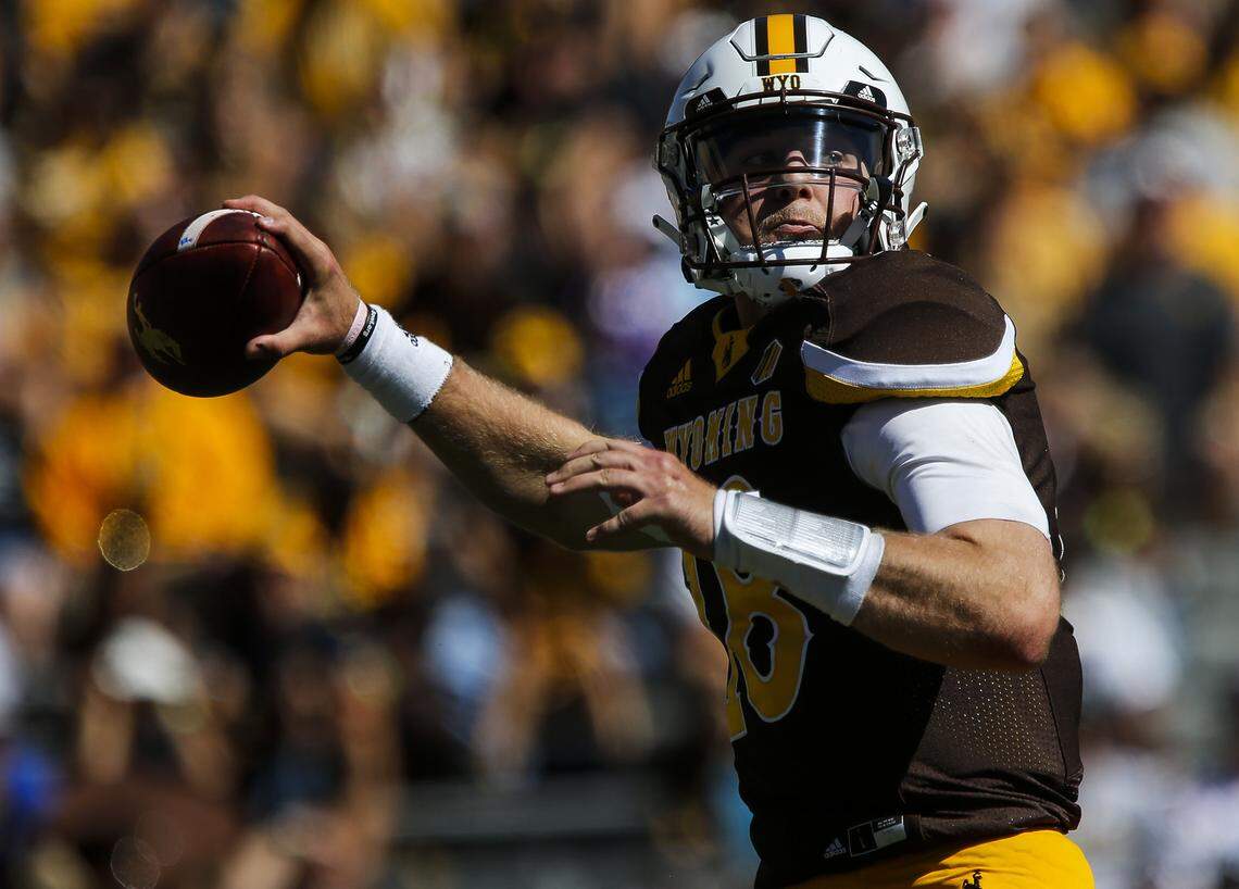 Wyoming quarterback Tyler Vander Waal (18) ranks 10th of 11 qualifying quarterbacks in the Mountain West Conference in passing efficiency rating.