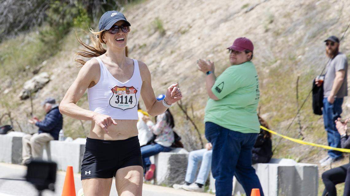 Boise’s Franny Zander, a teacher in Meridian, is the first woman to cross the finish line at the Race to Robie Creek, the legendary half-marathon.
