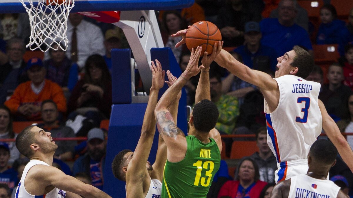 Boise State guard Justinian Jessup blocks a shot by Oregon forward Paul White in the first half Saturday, Dec. 29, 2018, at Taco Bell Arena in Boise.