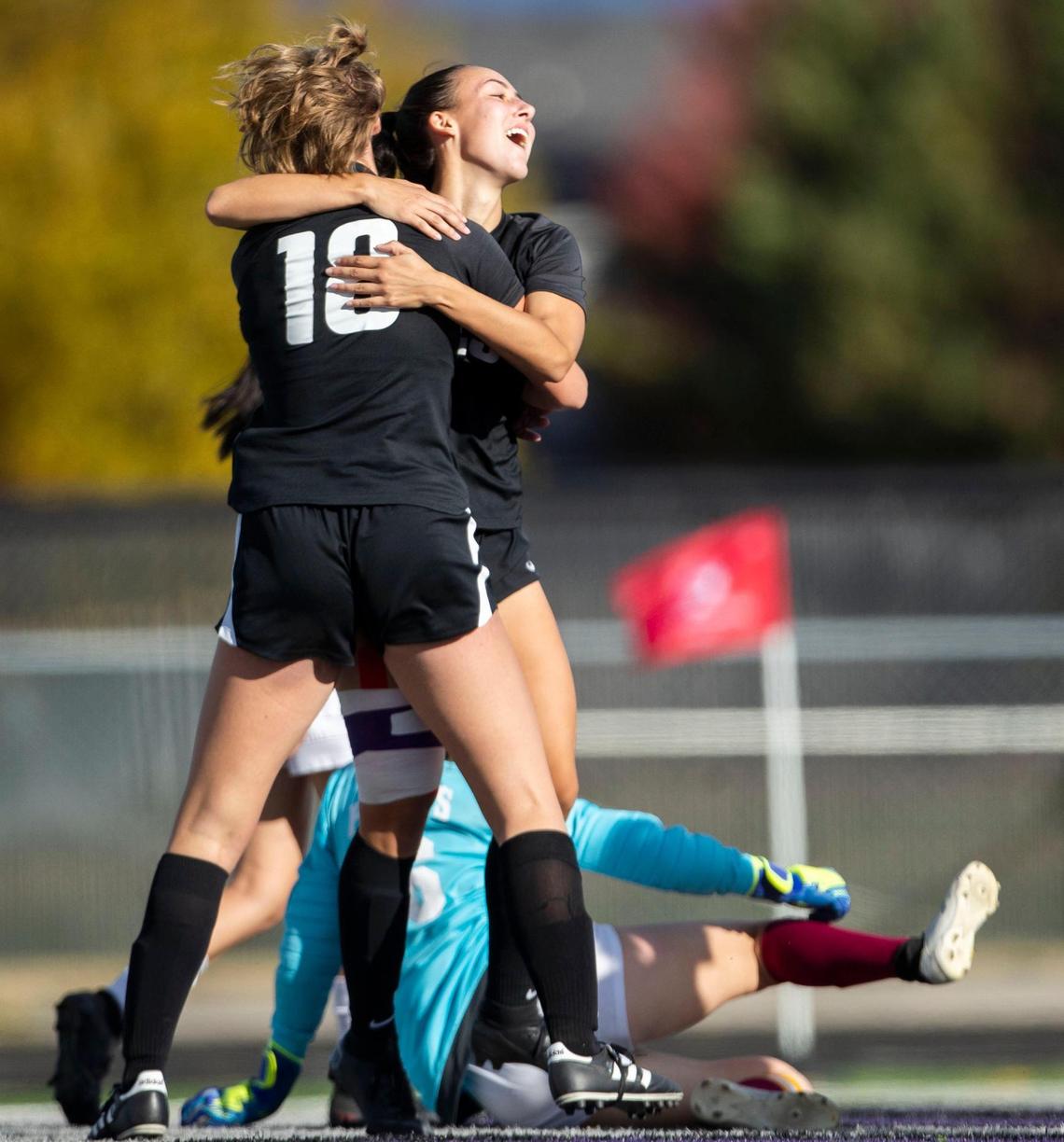 Rocky Mountain midfielder Tryne Tamminga, front, hugs teammate Nadia Kincaid the Grizzlies tied Centenial at 1-1 Thursday. The Grizzlies won 3-1.