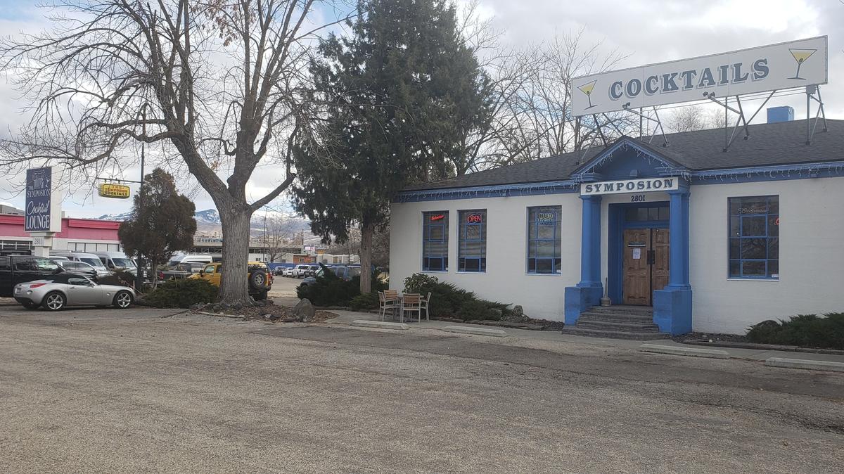 The Symposion bar at 2801 Fletcher Street would remain if a proposed complex with two apartment buildings, an office building and retail space is built near 27th Street and Fairview Avenue. The building in the background where Butler Customs and Wandervans operates would be torn down.