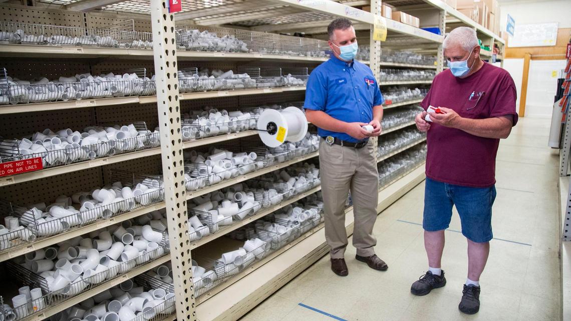Grover’s Manager Steve Broomhall helps longtime customer Noel Jackson, Boise, on a visit to the Boise store Saturday, Aug. 8, 2020. The hardware store employees wear protective masks as they help customers, who are also required to wear a face covering while in the store during the coronavirus pandemic.