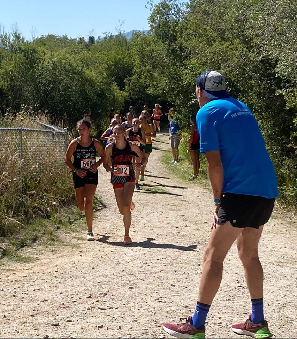 Tracy Harris, right, has been the head cross country coach at Mountain View since the school opened in 2003. He is retiring after the school year.