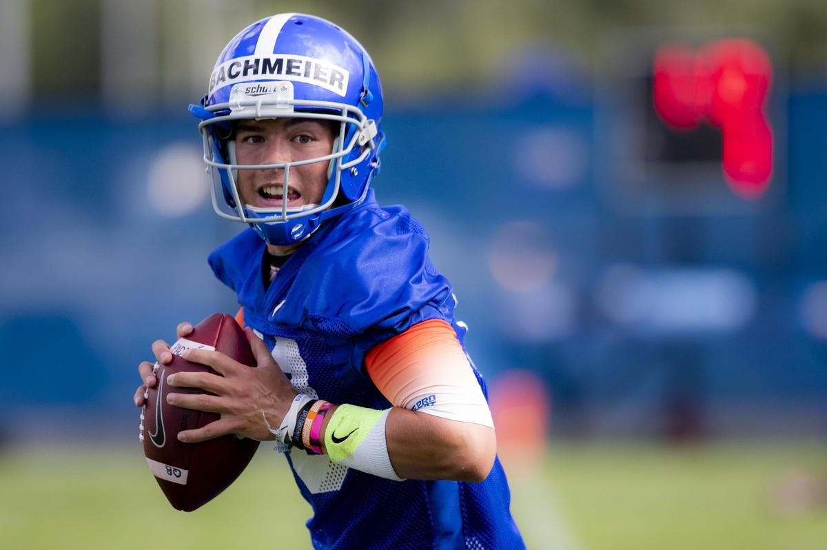 Boise State quarterback Hank Bachmeier runs drills during the Broncos’ fall camp on Aug. 2, 2019. He was home-schooled until high school.