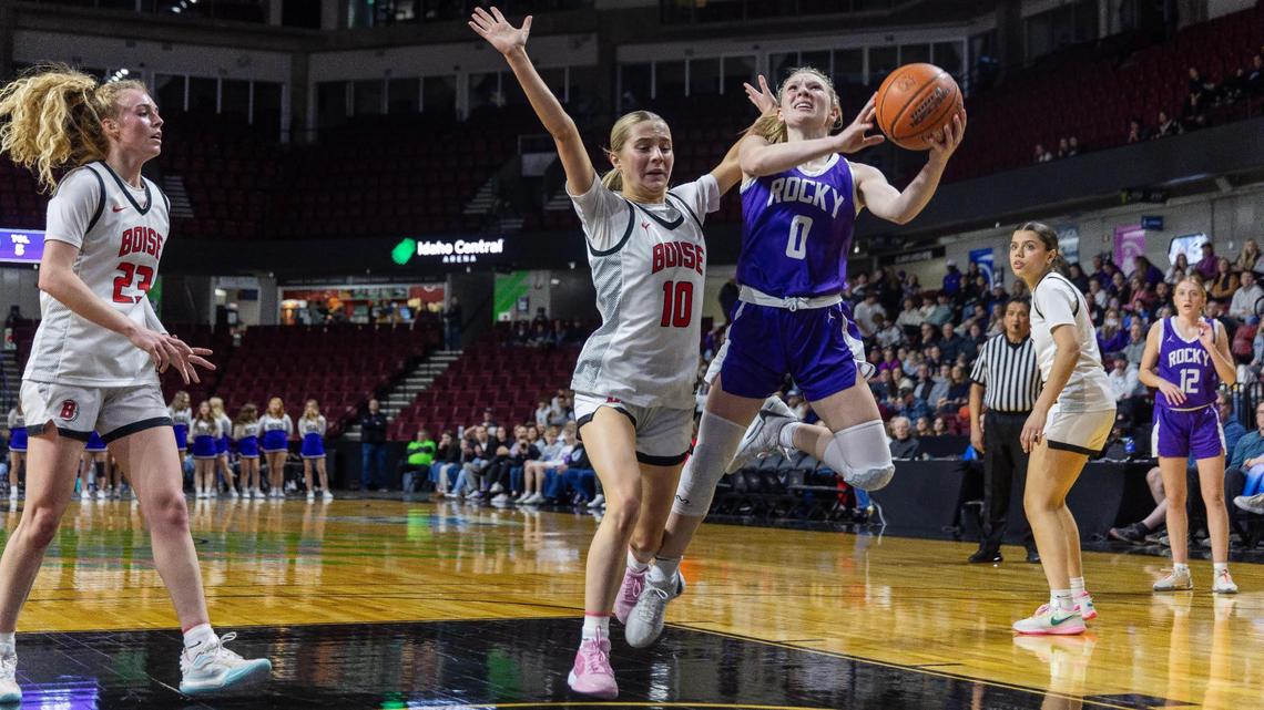 Rocky Mountain’s Logan Sailors is fouled by Boise’s Morgan Montgomery in the first half of the 5A District Three Tournament championship held at Idaho Central Arena in Boise last season.