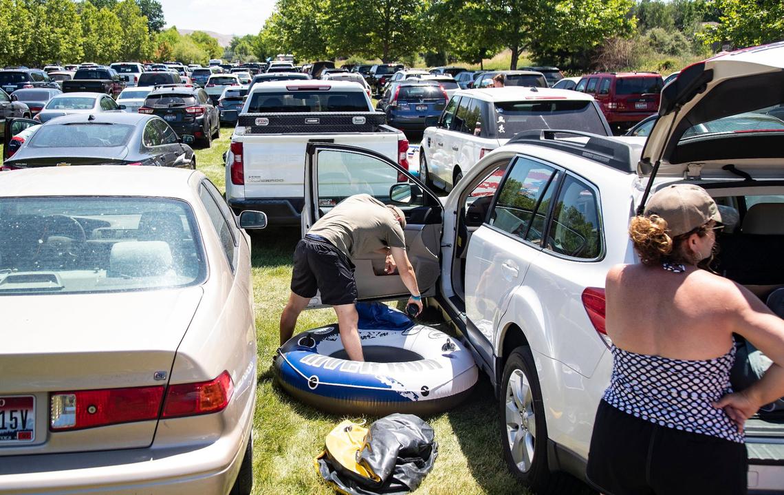 The overflow parking lot at Barber Park fills up with people parking to float the Boise River on Saturday, June 26, 2021. Increased traffic at the Boise River Float put-in at Barber Park has led to the city enforcing no parking on neighborhood streets as well as encouraging people to park at Ann Morrison Park and take the shuttle to Barber Park.