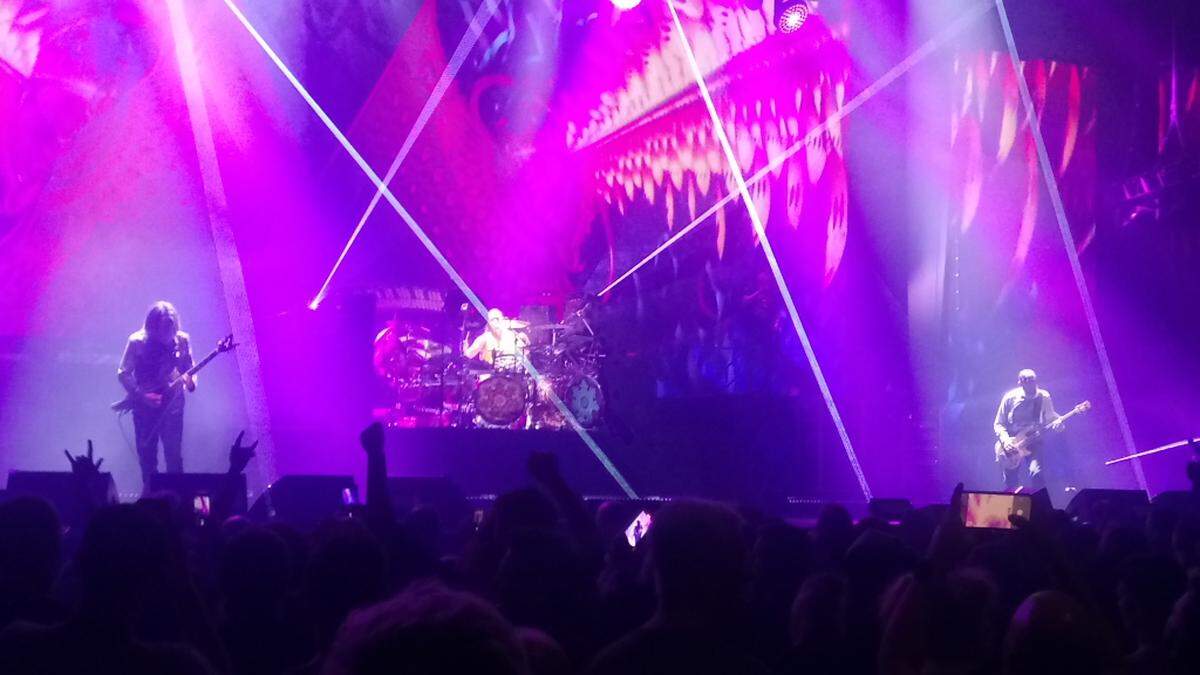 Members of Tool shown performing in Birmingham, England, in 2022.