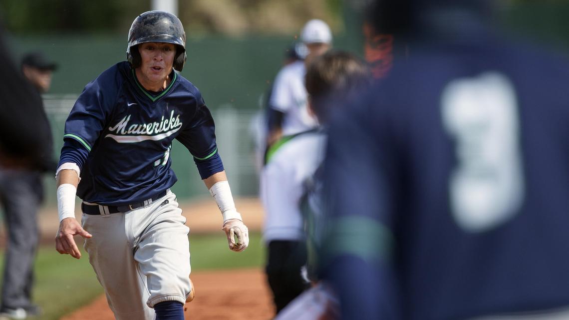 Mountain View senior Matthew Reynolds sprints to home plate and evades a tag by Eagle catcher Cannon Morgan in the semifinals of the state 5A baseball tournament Saturday, May 18, 2019 at Memorial Stadium in Boise.