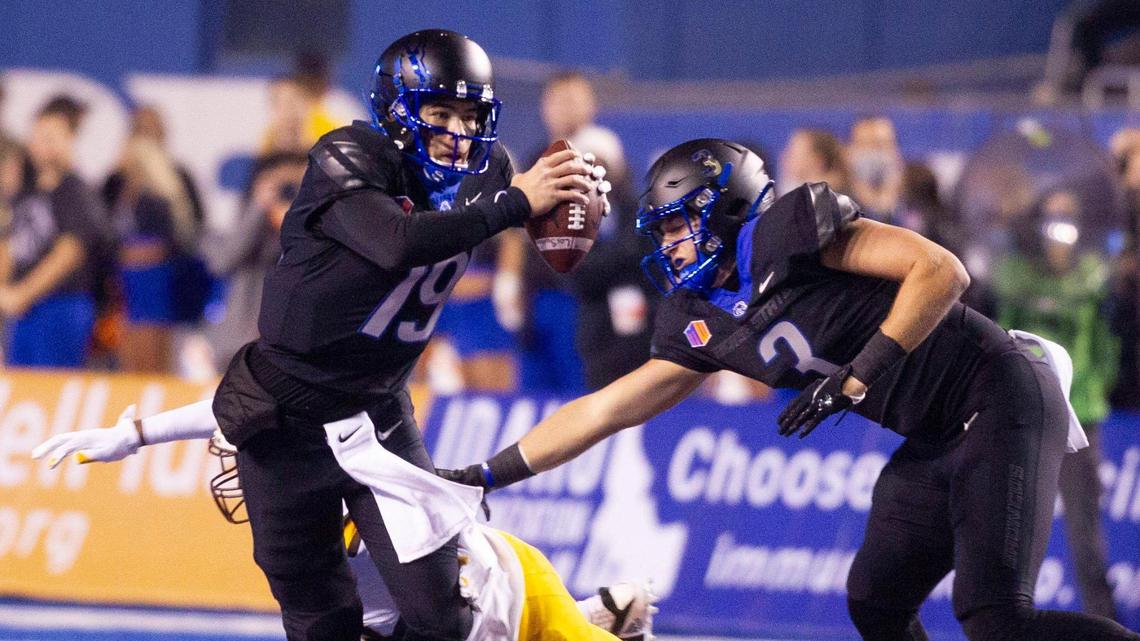 Boise State quarterback Hank Bachmeier escapes a Wyoming defender during the first half of the Broncos’ win over the Cowboys in November. Bachmeier said he suffered a knee injury in the Broncos’ win at Utah State on Sept. 25.