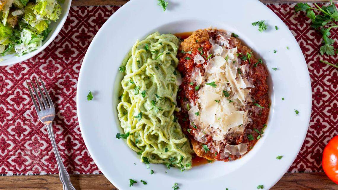 Chicken Parmigiana ($18.95) at il Sugo: Crispy fried chicken breast, basil pesto linguine, house arrabiata sauce, mozzarella, parmesan.
