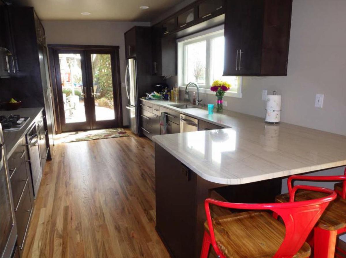 Before: This photo of the kitchen reflect the remodel that Laura and Todd Nelson did on their own in 2015. The backdoor marks where the dining room is today.